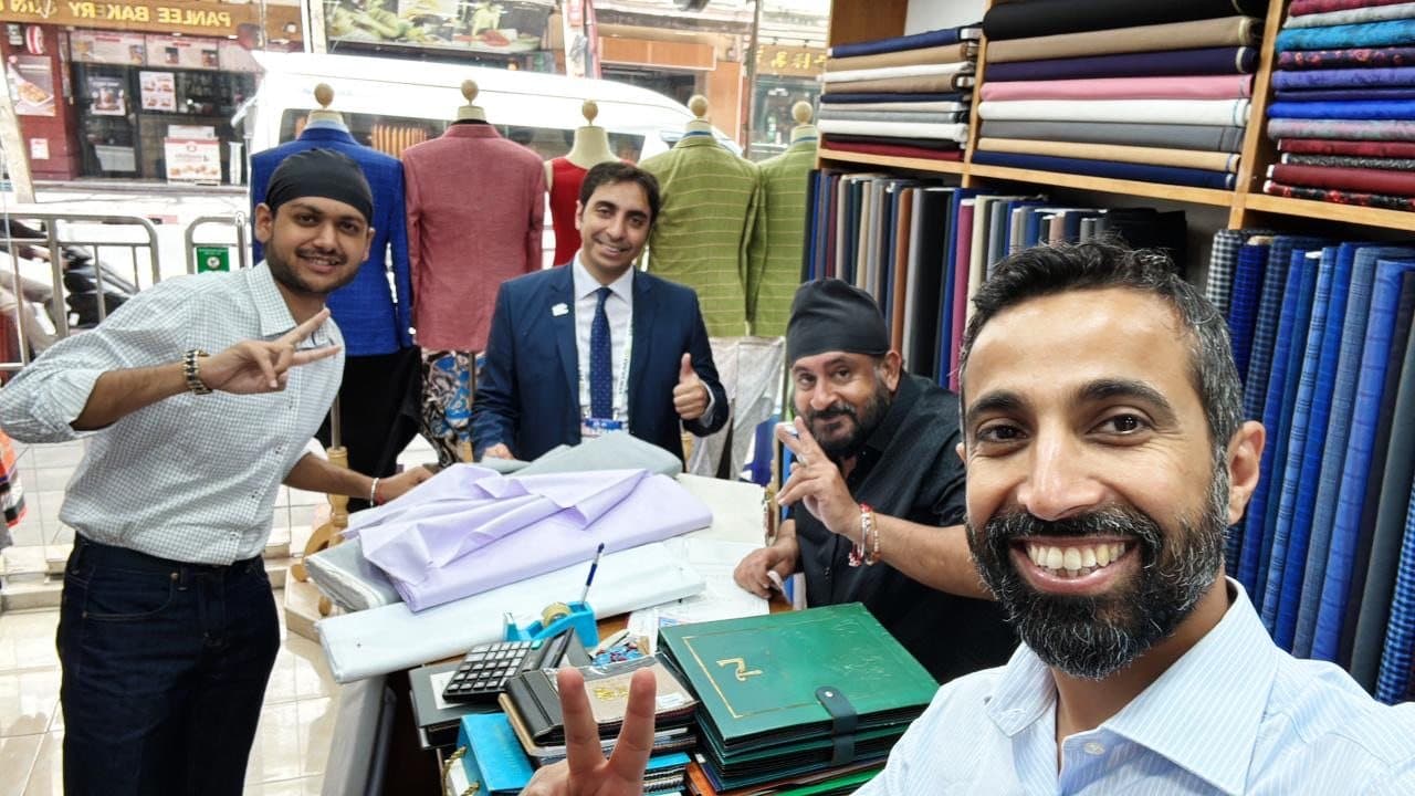 Client fitting photo inside the Bang Rak tailoring shop